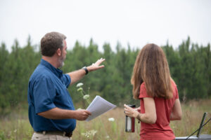 TIR members looking at the field